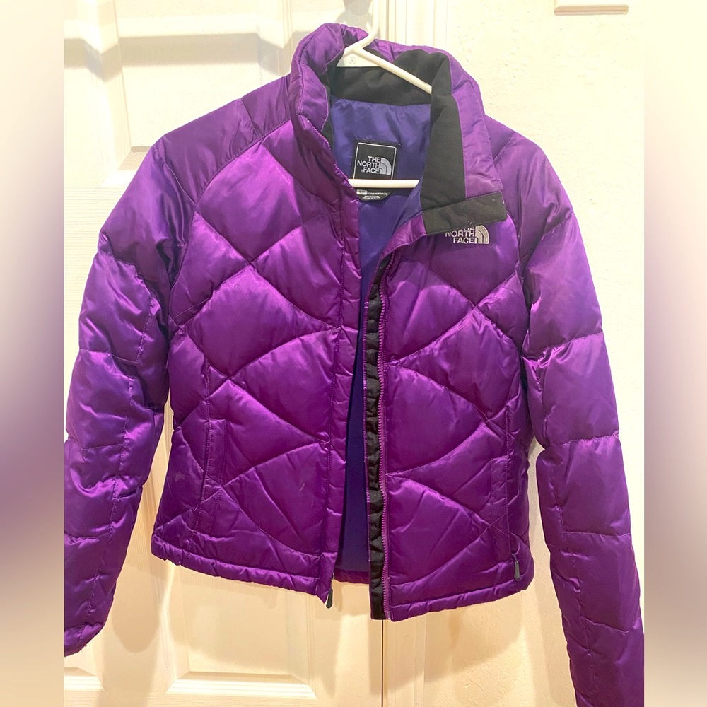 Small North Face puffer jacket in beautiful purple! Stand out while staying warm
